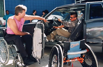 YLF exibitor and delegate looking at accessible car during Technology Fair. YLF exibitor and delegate at the Technology Fair.